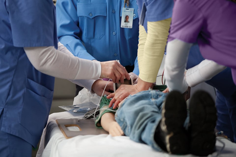 Team performing pediatric advanced life support